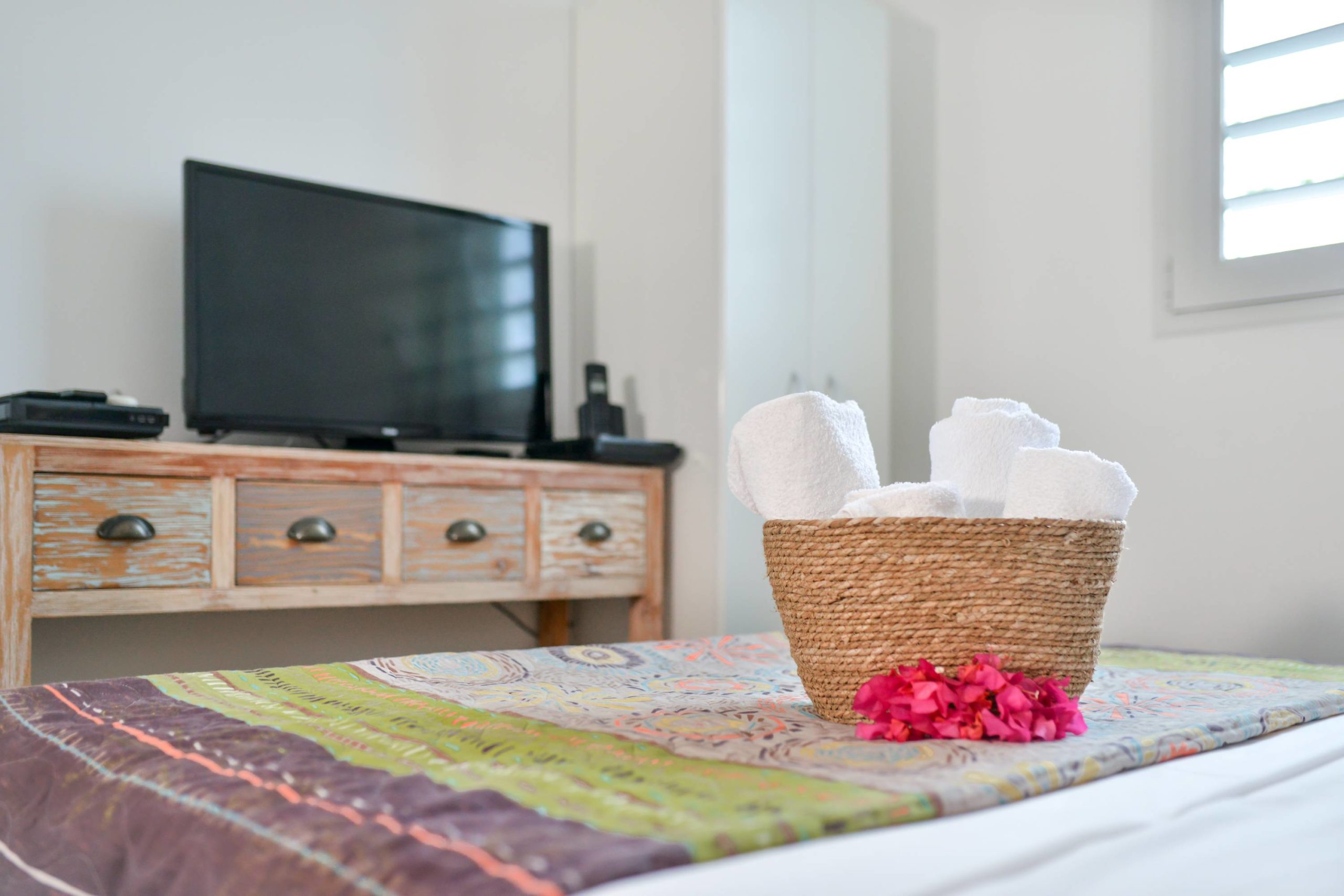 TV on the pink bungalow's bedroom